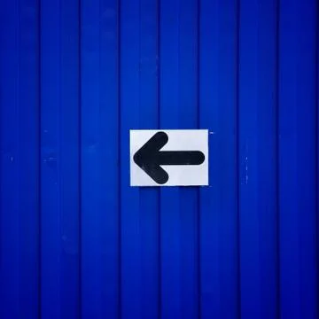 Black arrow direction stick on container. Stock Photos