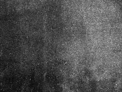 Black asphalt texture background with rough surface and gradient lighting, .. Foto stock