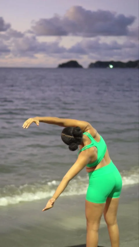 Black athlete exercising on the beach Stock Footage 226832962