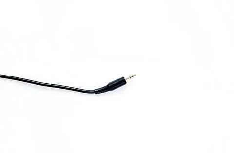 Black audio cable with 3.5mm jack on white background Stock Photos