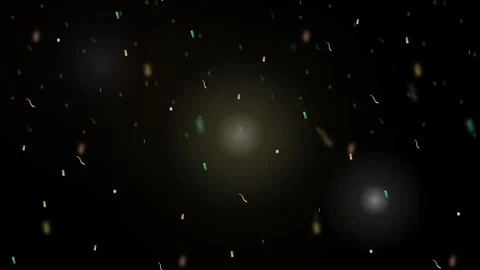 Black backdrop with a festive scattering of colorful confetti and bokeh light 動画素材 335826287