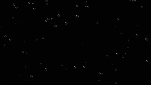 Black background with bubbles rising smoothly. The release of carbon dioxide. Stock Footage 115969961