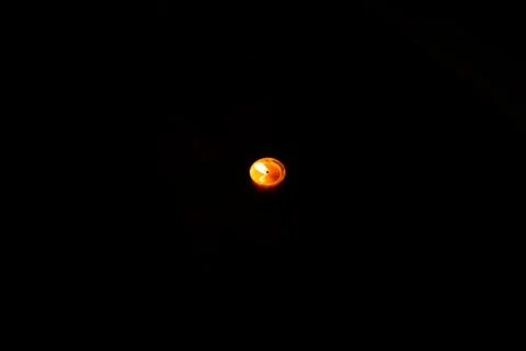 On a black background, a burning candle 스톡 사진