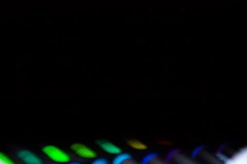Black background with defocused set of bright multicolored colorful felt-tip Stock Photos