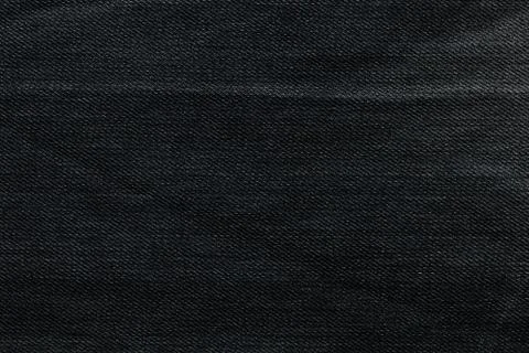 Black background, denim jeans background. Jeans texture, fabric. Stock Photos