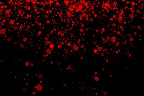 Black background with drops, dots, blots, megumi and dust. Red. Stock Photos