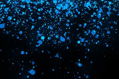 Black background with drops, dots, blots, megumi and dust. Of blue color. Stockfoto's