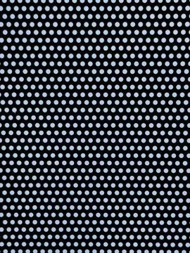Black background with evenly spaced white polka dots pattern Stock Photos