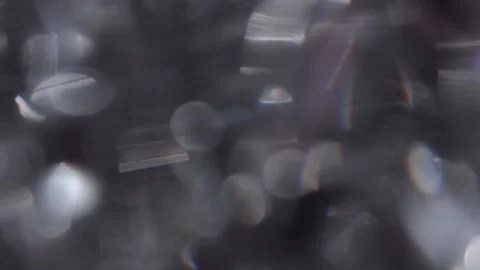 Black background, fast motion, white bokeh light, crystal, prism light reflectio Видео 318511627