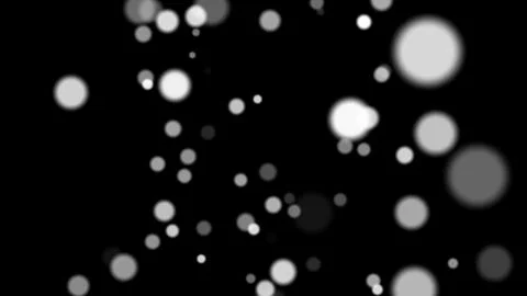 Black background with floating glowing bokeh particles Stock Illustration