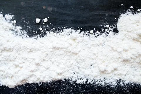Black background with flour Stock Photos
