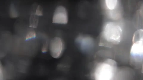 Black background, movement of light rays, bokeh, crystal prism Video stock 318512918