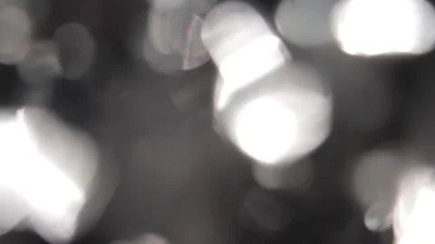 Black background, movement of light rays, bokeh, crystal prism Видео 318513695
