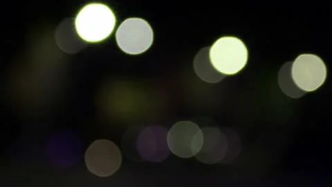 Black background with multicolor light effect. background with bokeh blur effect Stock Footage 217376110