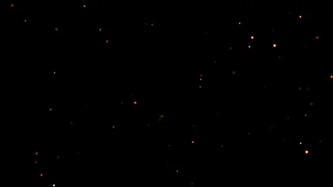 A Black Background With Orange And Yellow Lights Stock Footage 329544676