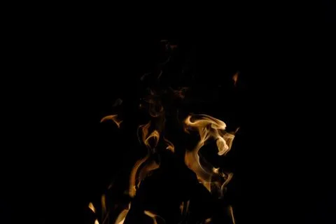 Black background with a pattern of fire and smoke. Stock Photos