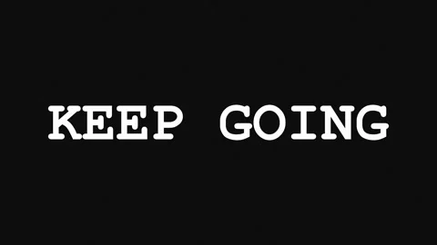 Black background with repeating white text KEEP GOING inspirational message.. Stock Footage 345621131