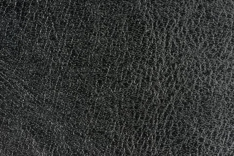 Black background with silver bubbles imitation. Old artificial leather. Stock Photos
