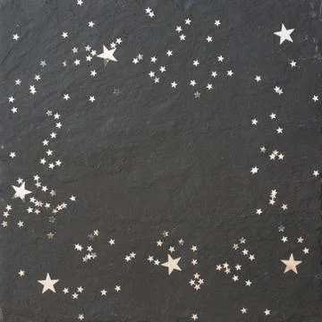 Black background with silver stars. Stock Photos
