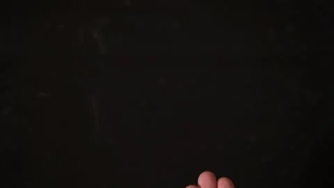 On black background in slow motion out of the blister squeezed, pills in hand Stock Footage 130198819