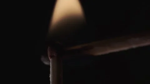 On a black background in a slow video a match lights up and burns Stock Footage 143540119