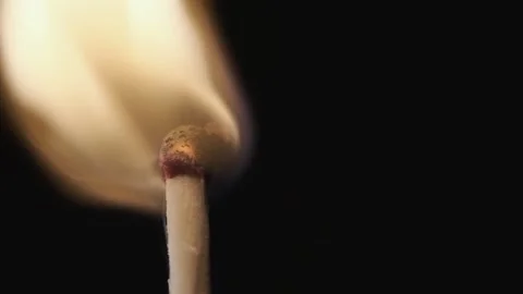 On a black background in a slow video a match lights up and burns Stock Footage 143540193