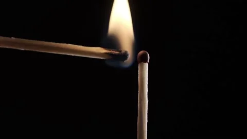 On a black background in a slow video a match lights up and burns Stock Footage 143540220