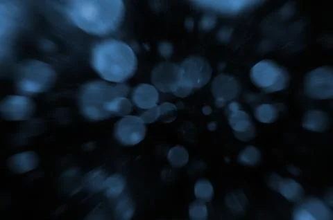 Black Background with Soft Blue Bokeh Lights and Abstract Glowing Light Effec Stock Photos