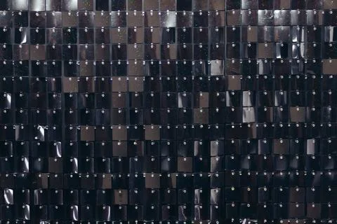 Black background of square shiny sequins Stock Photos