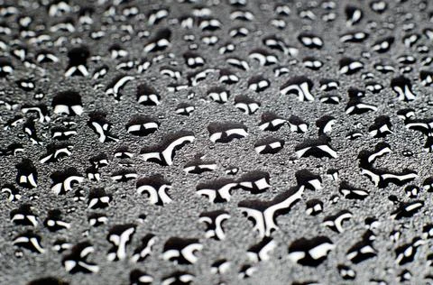 Black background with water drops, selective focus Stock Photos