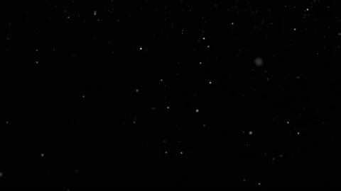 Black background with white particles falling like snow to the side Stock Footage 143194961