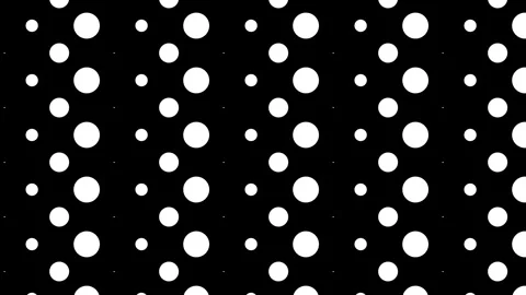 Black background with white polka dots, seamless looping. Stock Footage 286416180