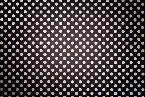 Black background from wrapping paper with a pattern of white polka dot closeu Stock Photos