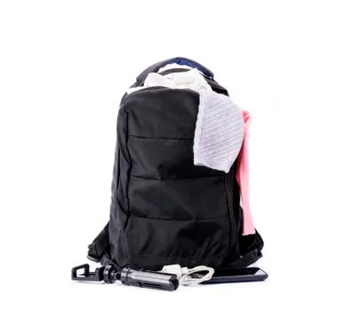 Black backpack and clothes Mobile phone For travel and tourism On a white bac Foto stock