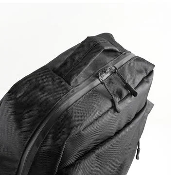 Black backpack with handle and compartments on a zipper. Casual rucksack Stock Photos