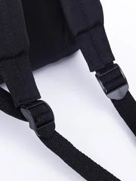 Black backpack shoulder strap close-up Stock Photos