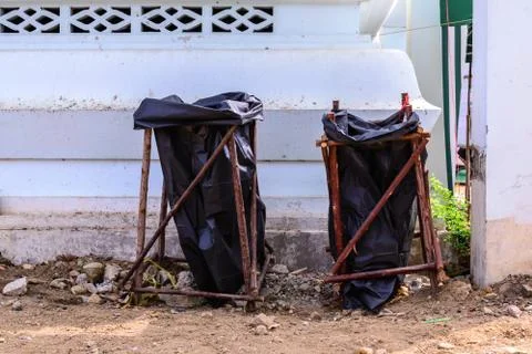 Black bag use for keep garbage in city. Stock Photos