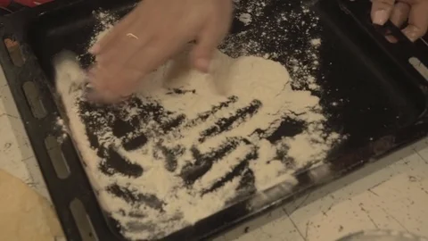 Black on a Baking Sheet Pour the Flour Stock Footage 74150563