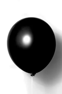 Black balloon on white background with shadow. Side glare. Stock Photos