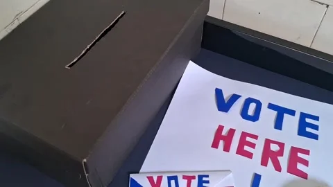 Black ballot box with vote here sign for election video motion Stock Footage 341700597