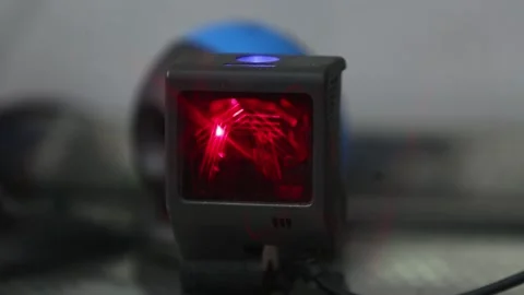 Black Barcode Scanner Projecting Red Laser Beams on Stand 库存影片 334642597