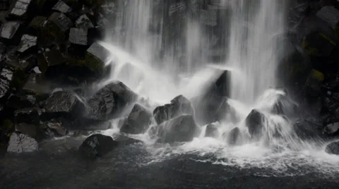 Black basalt rocks of the and falling water, Iceland Stock Footage 33752289