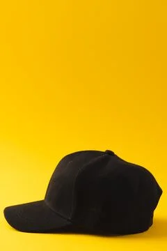 Black baseball cap and copy space on yellow background イラスト素材