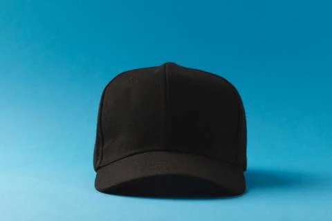 Black baseball cap and copy space on blue background Stock Illustration