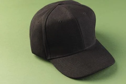 Black baseball cap and copy space on green background イラスト素材