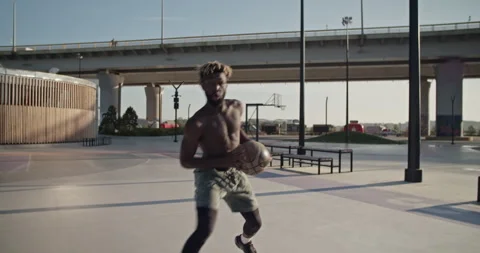 Black basketball player preparing to throw ball Stock Footage 213307242