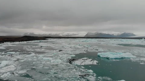 Black-beach and ice floating near the beach Stock Footage 255695386