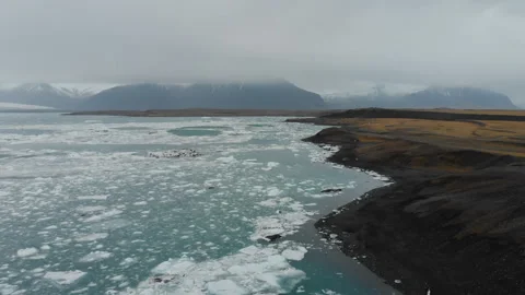 Black beach with ice in Iceland Stock Footage 255695732