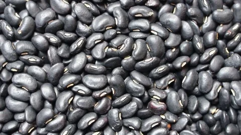 Black beans background, rotation shot Stock Footage 79617537
