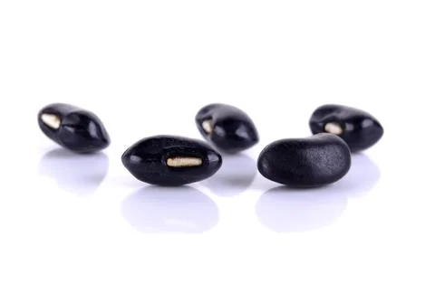 Black beans isolated on the white background Stock Photos